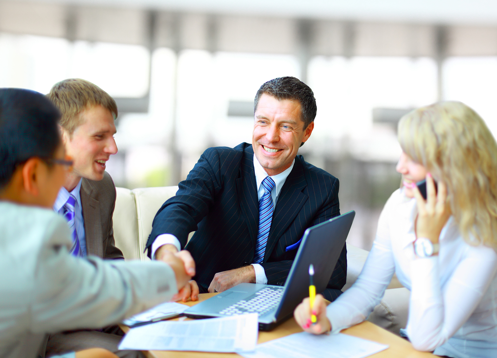 Professionals discussing hiring strategy